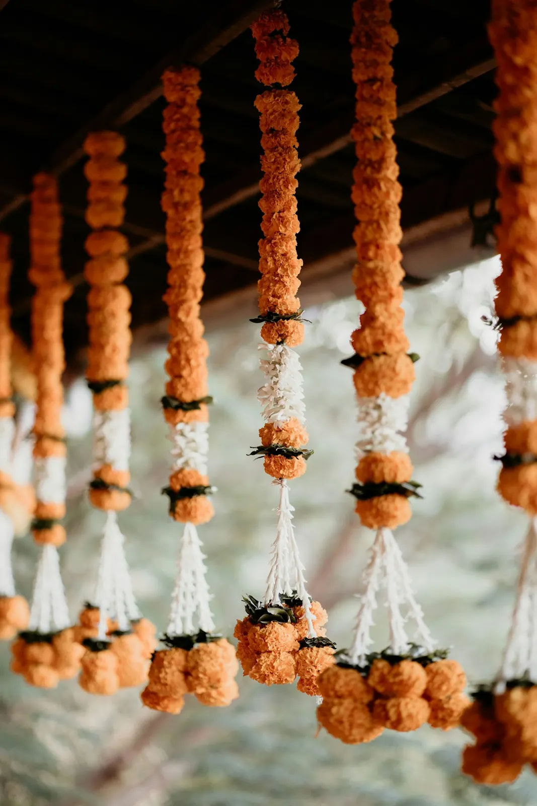 Hanging marigold and jasmine garland décor