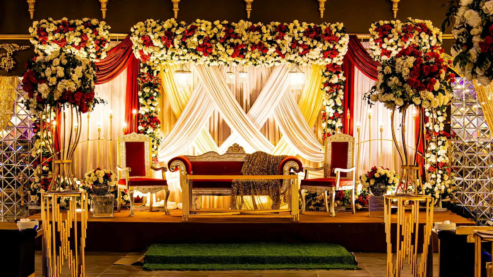 Wedding stage decorated with flowers and drapery