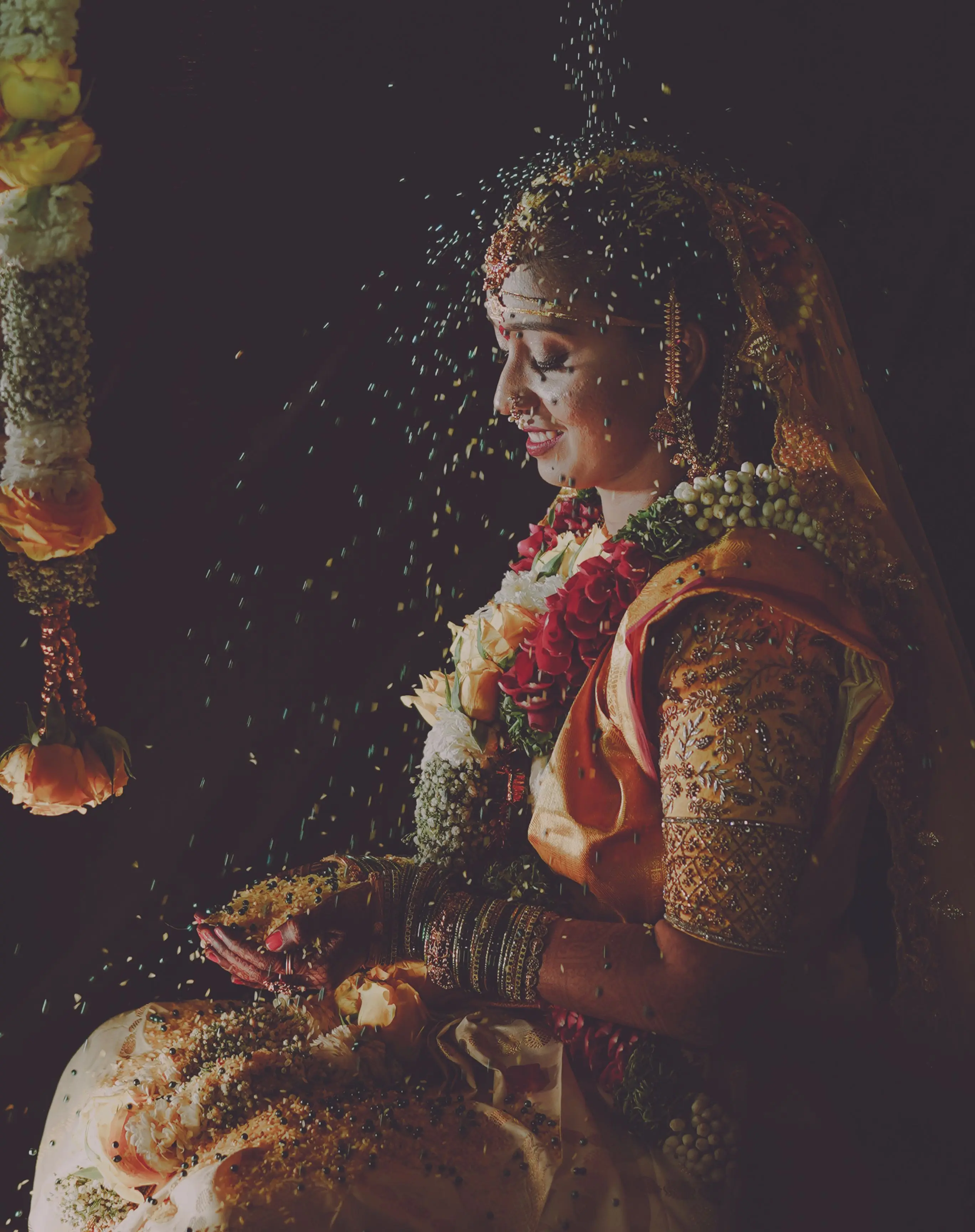 Henna-decorated hands of the bride and groom